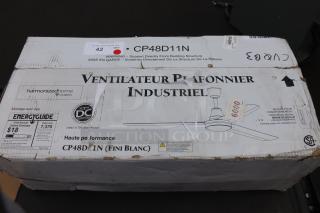 Canarm CP48D11N 48" white industrial ceiling fan in box, 7370 CFM, 120V, new scratch-n-dent condition, EnergyGuide tag visible.