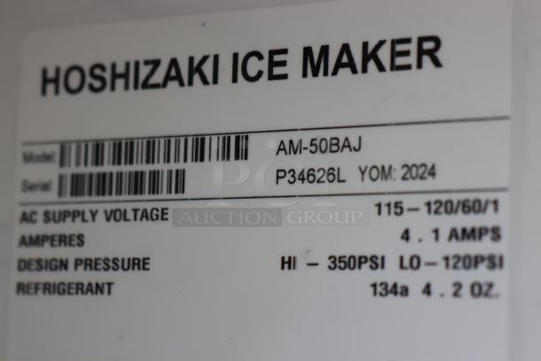 Hoshizaki AM-50BAJ ice machine label detailing model, serial number P34626L, voltage, and design pressure.