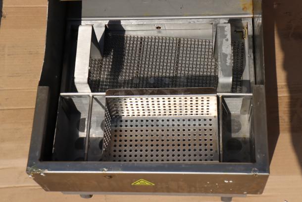 Fryclone 55 lb. portable fryer oil filter machine, model 259OFM55, with steel mesh, perforated plates, and safety label.