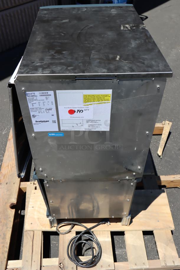 BRAND NEW Scotsman HID312A-1 ice machine and water dispenser, 12 lb bin, air-cooled, 115V, slight scratches, with labels.
