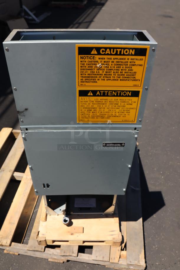Wolf by Vulcan WF400-1 floor fryer on pallet, showing caution labels. Model 950WF400N, natural gas, 120,000 BTU.