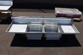 Regency 600S22323224 96" stainless steel sink, 16 gauge, two compartments, galvanized legs, minor dents. Labels note damage.