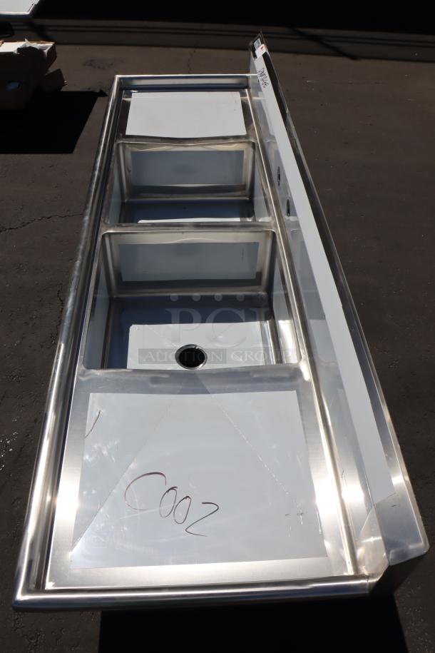 Regency 96" stainless steel two-compartment sink, model 600S22323224, with drainboards. New, minor dents, no packaging.