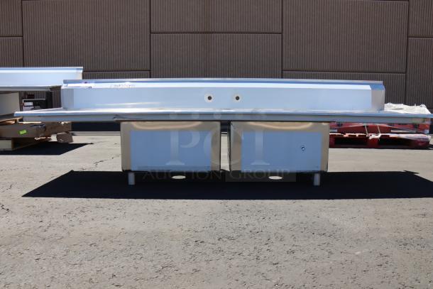 BRAND NEW Regency 96" two-compartment stainless steel sink with drainboards, minor dents, galvanized steel legs. Model 600S22323224.