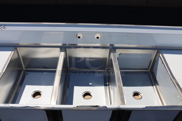 Regency 600S32030230 124" stainless steel commercial sink, three compartments, two drainboards, minor dents, brand new.