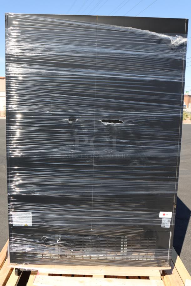 Brand new Avantco GDC-49-HC black swing glass door merchandiser, packaged and wrapped on a pallet, with visible minor dents.