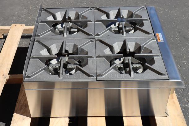 Cooking Performance Group R-CPG-24-NL 4 burner gas countertop range, 88,000 BTU, new with minor dents, no packaging.
