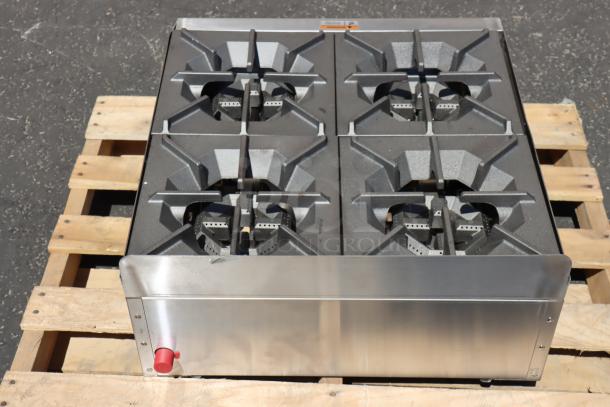 Brand new Cooking Performance Group R-CPG-24-NL 4 Burner Gas Countertop Range, minor dents, on a palette.