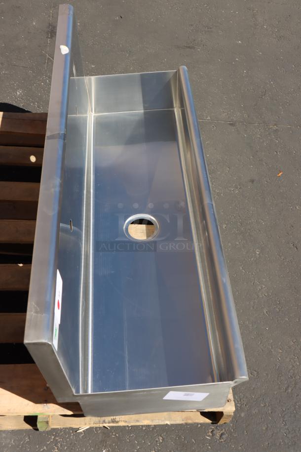 Brand new Regency 600HSMSB1848 wall-mounted 48"x17.5" hand sink. Includes wall brackets, drain connection, and basket. May have minor scratches.
