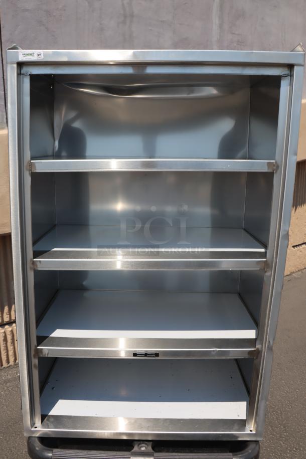 Brand new Regency 600CT5S1624E utility cart with five 16"x24" stainless steel shelves. Enclosed base, open front. Scratch-n-dent model.