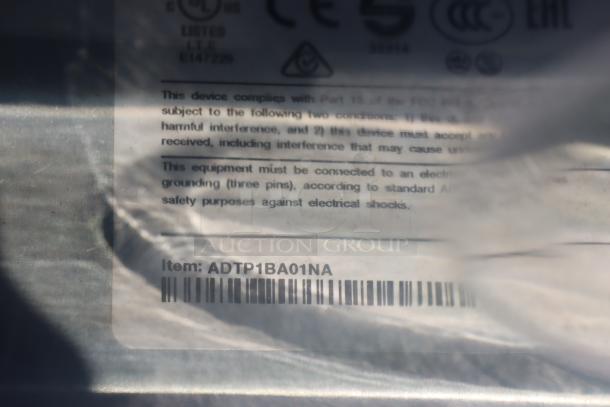 Avery-Dennison ADTP1BA01NA Tabletop Printer label, showing model and compliance information.