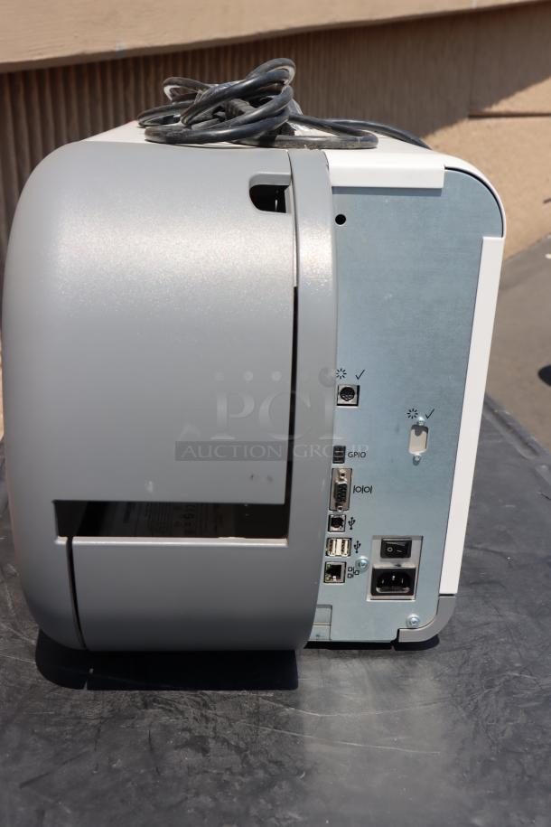 Brand new Avery-Dennison ADTP1BA01NA barcode label printer, model ADTP1. Ports visible on the side panel.