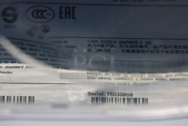 Brand new Avery-Dennison ADTP1BA01NA tabletop barcode label printer. Serial number: 16030959 visible on label.