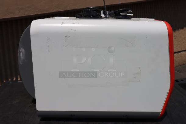 Brand new Avery-Dennison ADTP1BA01NA tabletop barcode label printer, model ADTP1, S/N 16030959, with power cord.
