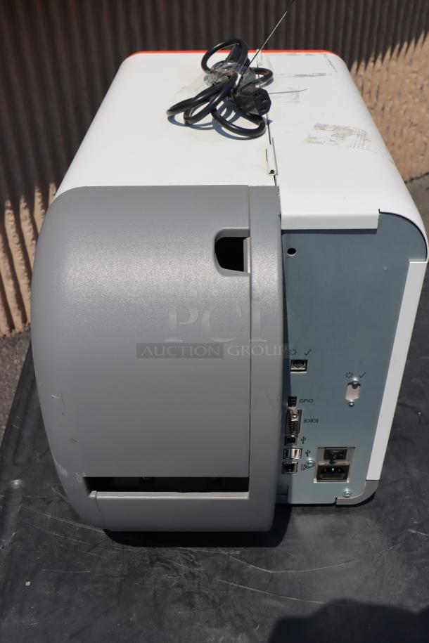 Brand new Avery-Dennison ADTP1BA01NA Barcode Label Printer, showing ports and power cord. S/N: 16030959.