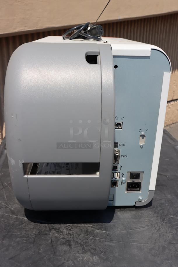 BRAND NEW Avery-Dennison ADTP1BA01NA Barcode Label Printer, Model ADTP1, serial 16030959; visible ports and connections.