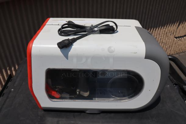Brand new Avery-Dennison ADTP1BA01NA barcode label printer with serial number 19085204, cable included.