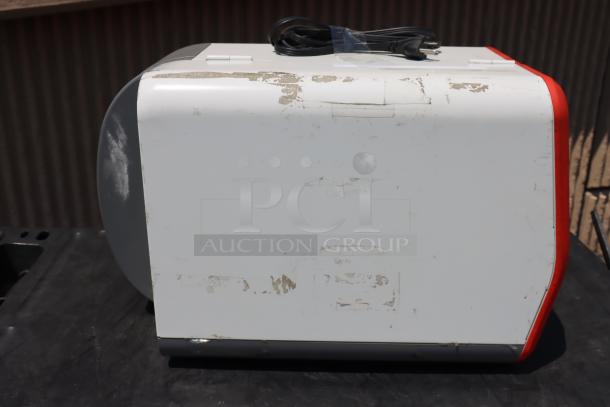 Avery-Dennison ADTP1BA01NA barcode label printer, new condition, visible wear on case, comes with power cord. Model ADTP1.