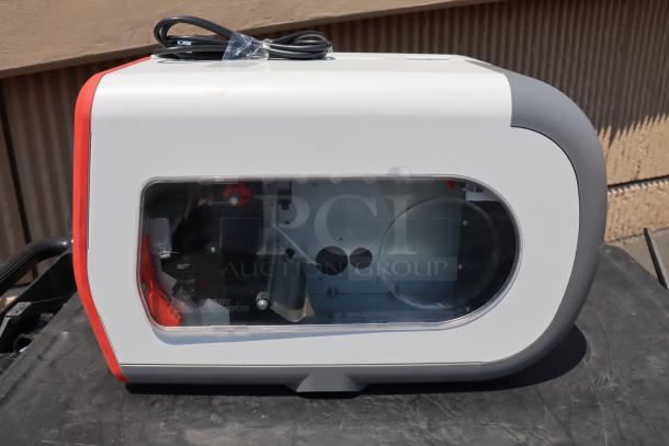 Brand new Avery-Dennison ADTP1EF01NA tabletop barcode label printer, visible serial number 22047929, unused condition.