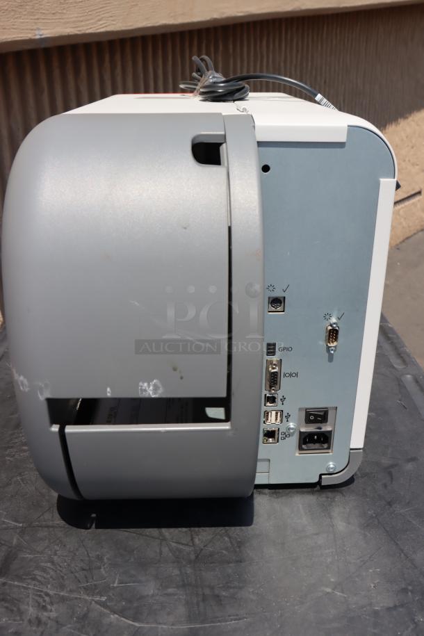 Brand new Avery-Dennison ADTP1EF01NA barcode label printer. Includes multiple ports and wiring. Model ADTP1.