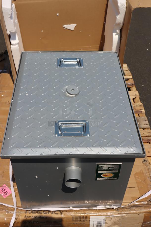 Brand new Regency 600GT15 30 lb. grease trap, 15 GPM capacity, 2" non-threaded connections, out of packaging.