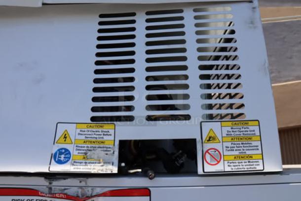 Leer 60AS-R290 73" ice merchandiser with straight front and galvanized steel doors, showing caution labels; new, tested.