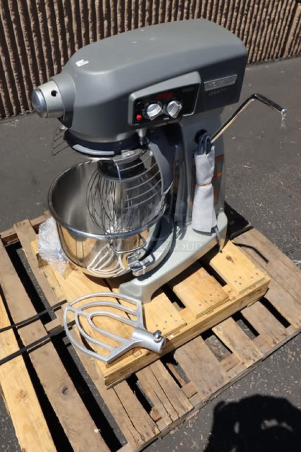 Hobart Legacy+ HL200 20 Qt. mixer with stainless steel bowl, beater, whip, dough hook; slight plastic lid damage.