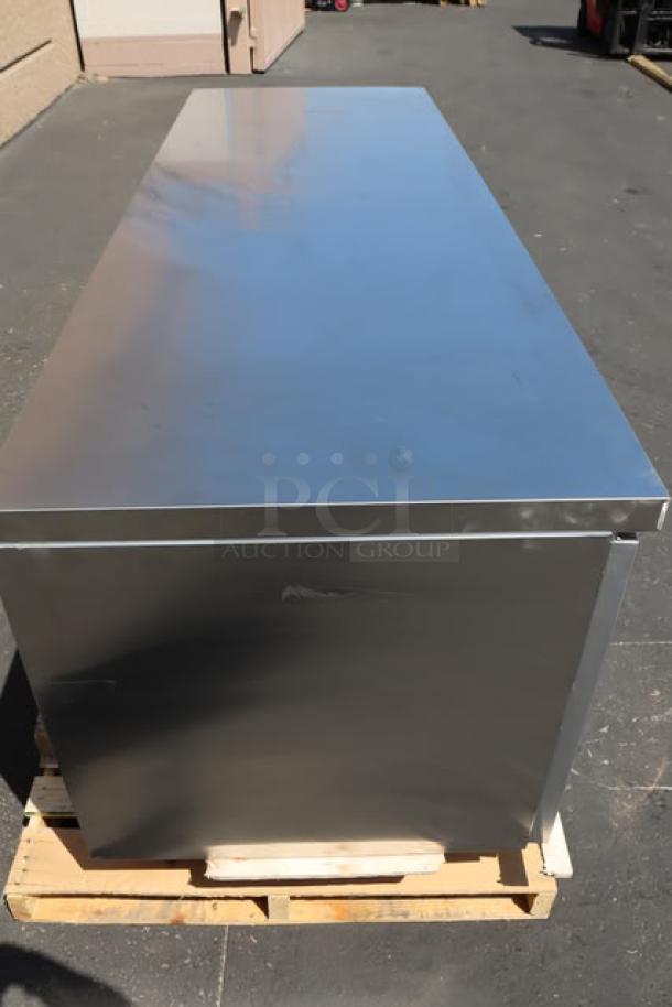 Avantco SS-UD-3R 93" stainless steel undercounter refrigerator, new, with scratch, dent, and one bent caster.