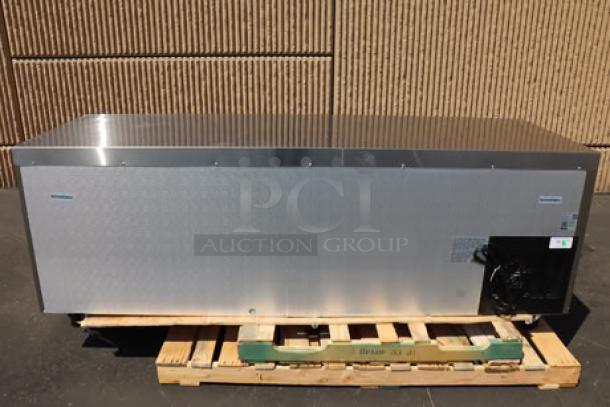 Avantco SS-UD-3R 93" stainless steel undercounter refrigerator, new, with scratches and bent caster, on a pallet.