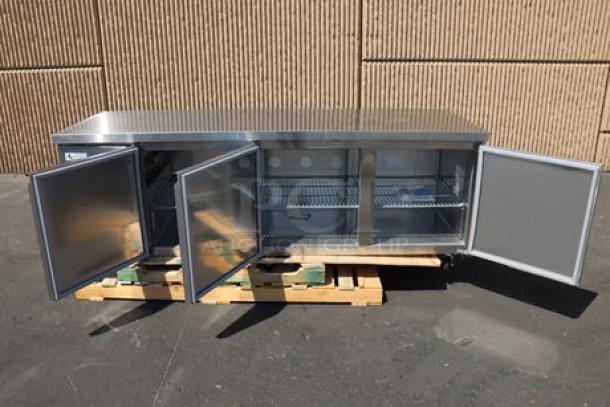 Avantco SS-UD-3R 93" stainless steel undercounter refrigerator, new condition, slight scratches, bent caster, open doors.