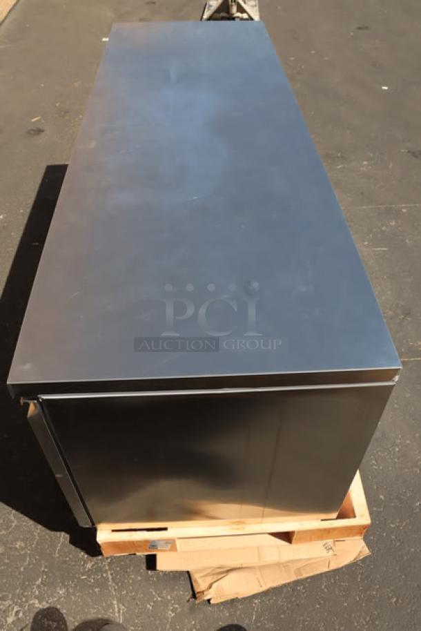 Avantco SS-UD-3R stainless steel undercounter refrigerator, 93", dented right corner, new condition, model and serial numbers visible.