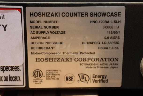 Hoshizaki HNC-120BA-L-SLH sushi display case label; Model: HNC-120BA-L-SLH, S/N: P000611A, 115V, R600a refrigerant.