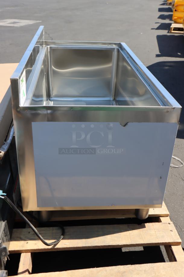 Regency 18"x36" stainless steel underbar ice bin with galvanized legs, missing lid, minor scratches and dents.