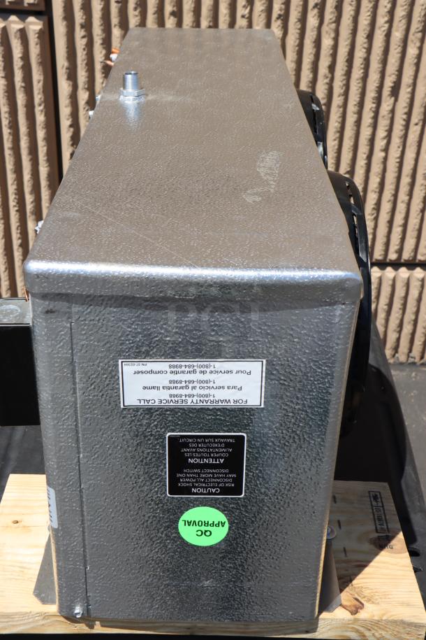 Brand new Master-Bilt 05-02595 evaporator with minor scratches and dents. Serial: E032500148. Labels show warranty service info.