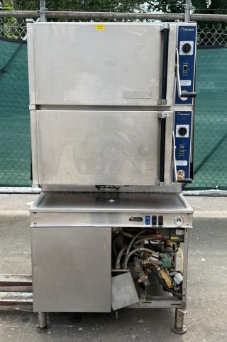 Cleveland Range 36PCGM300 Convection Steamer, gas, 2 compartments, stainless steel, visibly used, control dials, piping exposed.