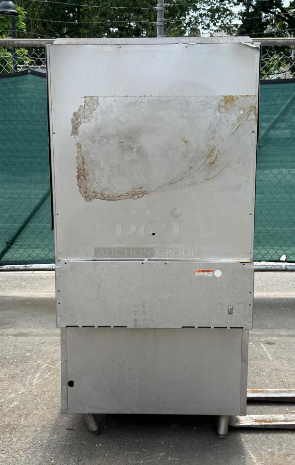 Vulcan 36" standard oven, 6 burners, 28000 BTU. Visible wear and rust marks. Metal finish. Industrial setting background.