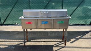 Stainless steel triple sink with labeled basins for wash, rinse, sanitize. Used condition, some rust on legs.