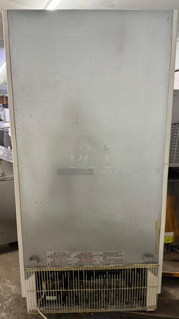 Turbo Air TOM-40W-N 39" white refrigerated air curtain merchandiser, used condition, visible wear on surface, safety labels at base.