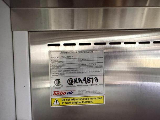 Turbo Air TOM-40W-N 39" white refrigerated air curtain merchandiser label displaying model, specifications, and safety warning.