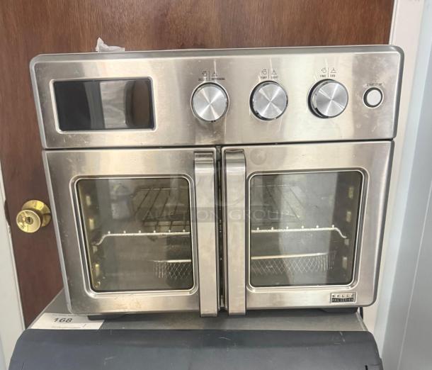 Bella Pro Series 12-in-1 6-Slice Toaster Oven with French doors, stainless steel, excellent condition, model label visible.