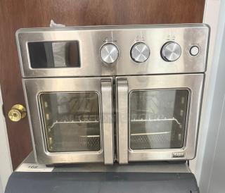 Bella Pro Series 12-in-1 6-Slice Toaster Oven with French doors, stainless steel, excellent condition, model label visible.