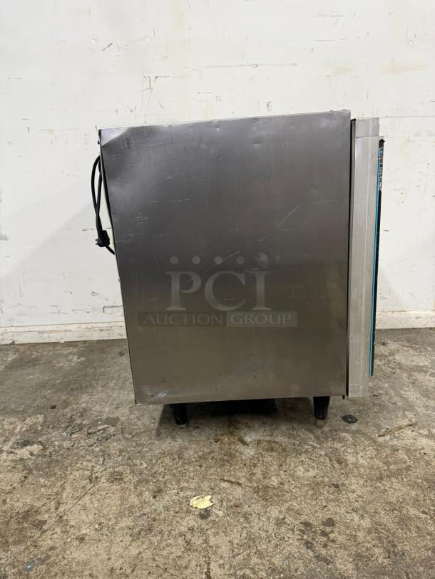 Silver King SKTTR7 undercounter refrigerator in stainless steel, showing wear. Model SKTTR7, with side power cord.