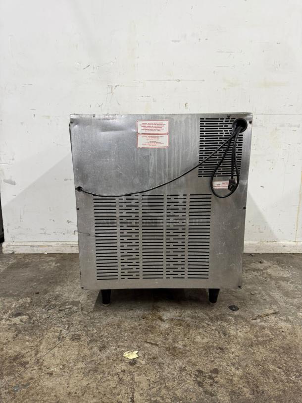 Silver King SKTTR7 undercounter refrigerator, stainless steel, used condition, rear view showing ventilation and power cord.