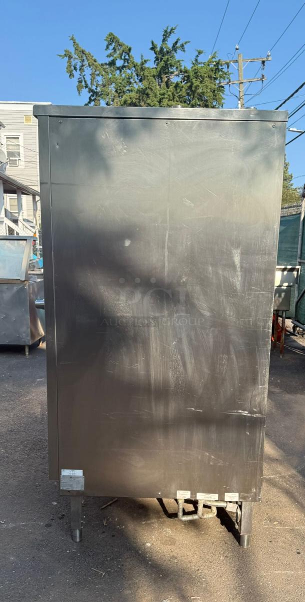 Cleveland Combi Craft Oven, stainless steel, used condition, visible marks, rear view showing pipes and labels at the base.