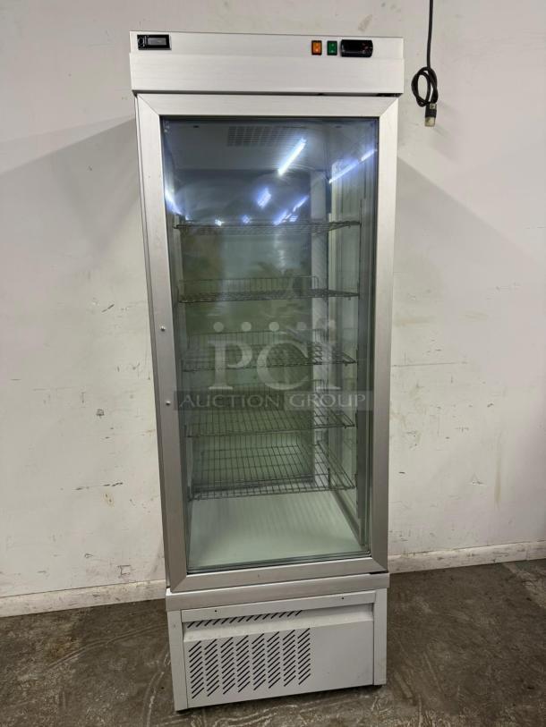TEKNA 4400NFN glass display case with four-sided visibility, shelving, and refrigerated storage. Tested and working condition.
