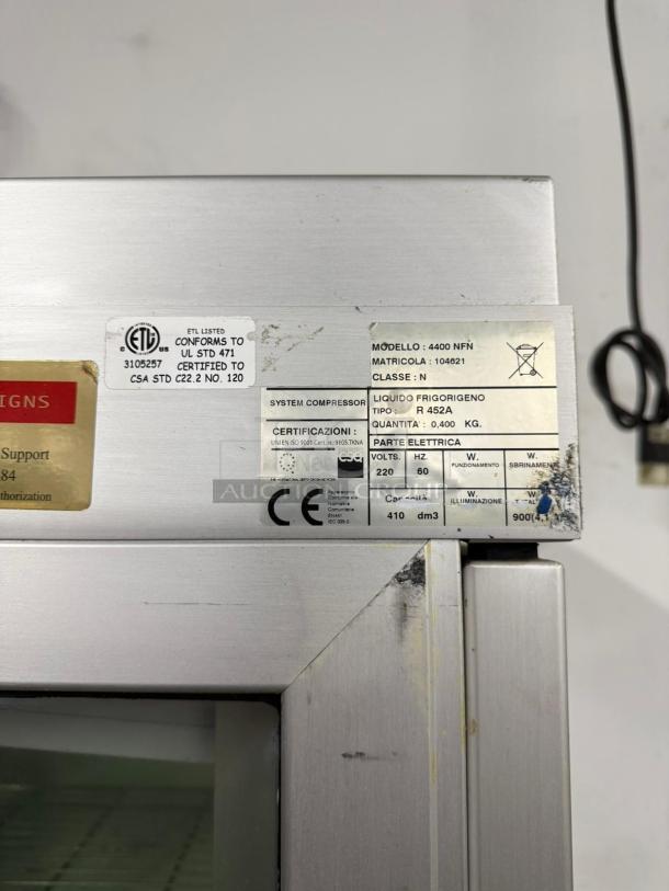 TEKNA 4400NFN refrigerated display case, 4-sided glass, tested/working, visible model label.
