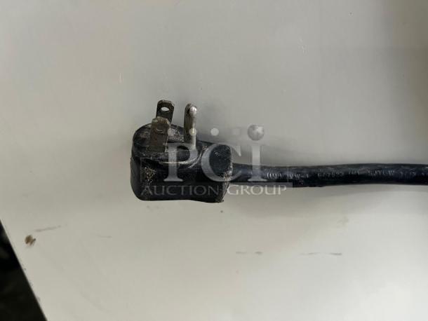 Power cord for Grab & Go Open Top Display Cooler in used condition. Plug appears intact; cooler tested and working.