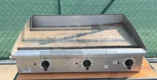 Toastmaster 36" gas griddle with thermostatic control, countertop flat grill, stainless steel, visible wear, Big Series label.