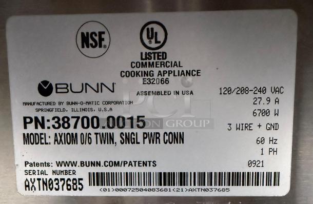 Label for Bunn Axiom 0/6 Twin 12 Cup Coffee Brewer, NSF and UL listed, model 38700.0015, serial AXTN037685, 6700W.