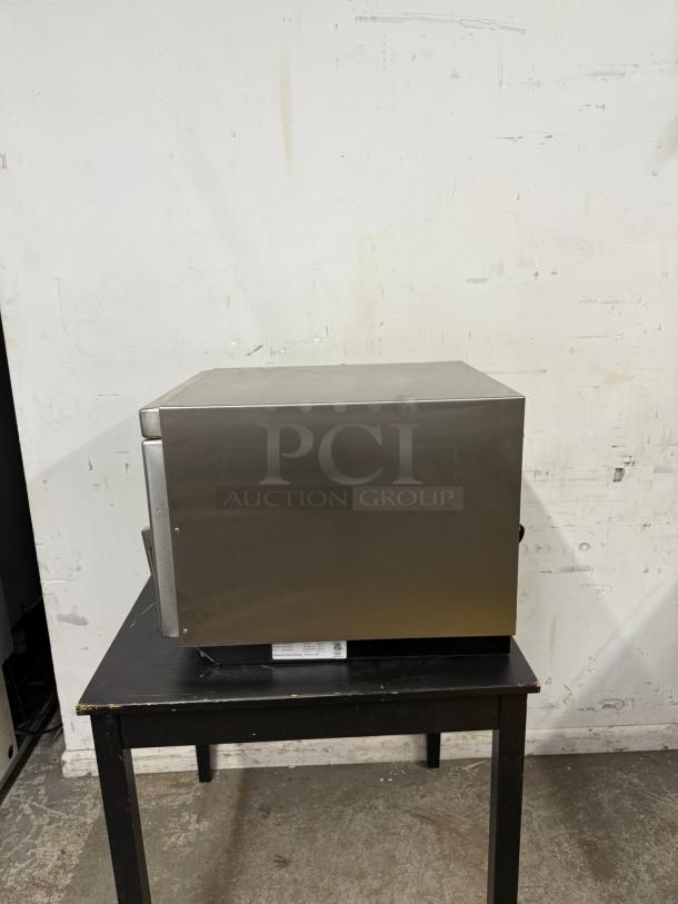 MENUMASTER RC17S2 19" commercial microwave, 1700 watts, stainless steel, model RC17SD20SI, shown on a black table.